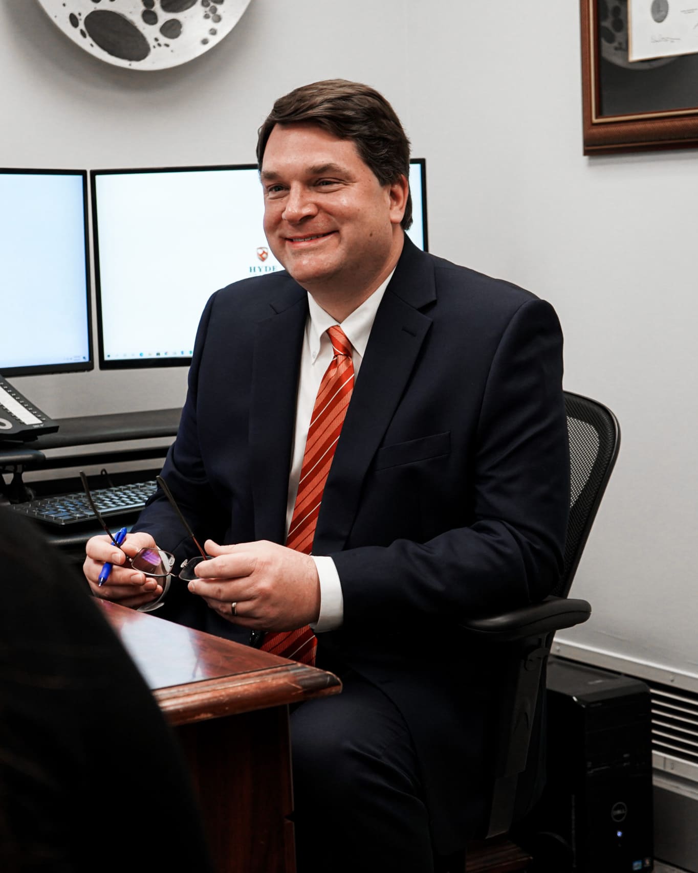 Max T. Hyde, Jr. at his desk in the Hyde Law Firm, P.A. office on East Main Street, Spartanburg, SC